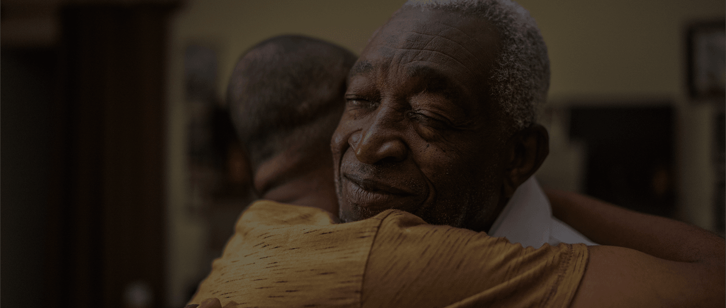 Elderly couple embracing